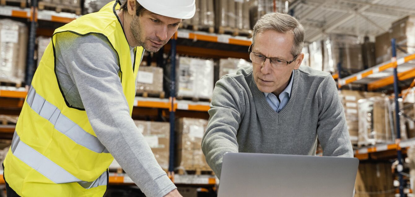 men-warehouse-working-laptop